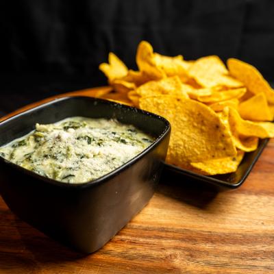 Spinach artichoke dip served with tortilla chips